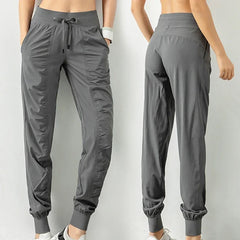 Nouveaux pantalons de survêtement tissu cordon course Sport Joggers femmes séchage rapide athlétique gymnase Fitness avec deux poches latérales pantalons d'exercice